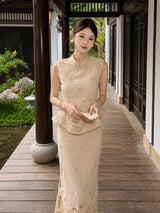 Model holding a folding fan, wearing a beige embroidered Cheongsam set with a mandarin collar and delicate lace details throughout.