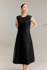 Front view of a women's black silk midi dress with a sleeveless design and subtle textured fabric, showcasing the elegant drape of the 100% silk material.