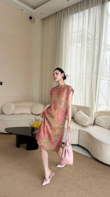 Model wearing a pink floral jacquard Cheongsam dress with a button-down front, styled with pink heels and a matching handbag.