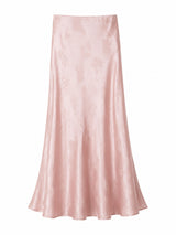 Flat lay of a pink A-line maxi skirt with delicate floral jacquard pattern and smooth satin finish, crafted from 65% Lyocell and 35% Viscose.