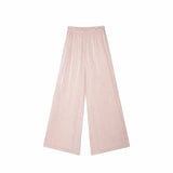Flat lay of pink pleated wide-leg pants with a delicate floral embroidered waistband, crafted from 100% polyester.