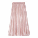 Flat lay of a pink shiny pleated maxi skirt with elastic waistband and flowy silhouette, crafted from 100% polyester.