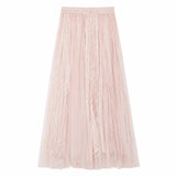 Flat lay of a pink pleated tulle maxi skirt with elastic waistband and delicate lace panels throughout, crafted from 100% polyester.
