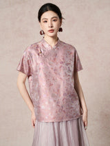 Front view of a purple silk top featuring a traditional stand collar and a delicate side frog button detail, highlighting the subtle sheen of the fabric.