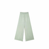 Flat lay of sage green pleated wide-leg pants with a delicate floral embroidered waistband, crafted from 100% polyester.