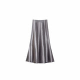Flat lay of a smoky purple satin A-line maxi skirt with a high waist and smooth flowing drape, crafted from 100% polyester.