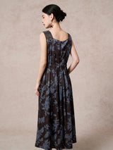 Back view of a brown 100% mulberry silk Xiangyunsha dress with blue floral jacquard, featuring a gathered waist, back zipper, and a flowing A-line skirt.