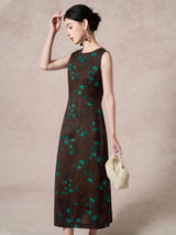 Side view of a brown 100% mulberry silk sleeveless dress with a round neckline and green floral jacquard pattern, showcasing the elegant A-line silhouette.