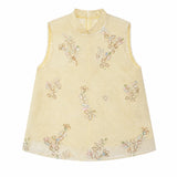 Flat lay of a yellow sleeveless Cheongsam vest with a mandarin collar, beaded edges, and intricate floral sequin embroidery, crafted from 100% polyester.