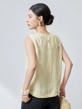 Side view of a pink silk top with a relaxed fit and jacquard texture, showcasing the elegant drape and handcrafted details.